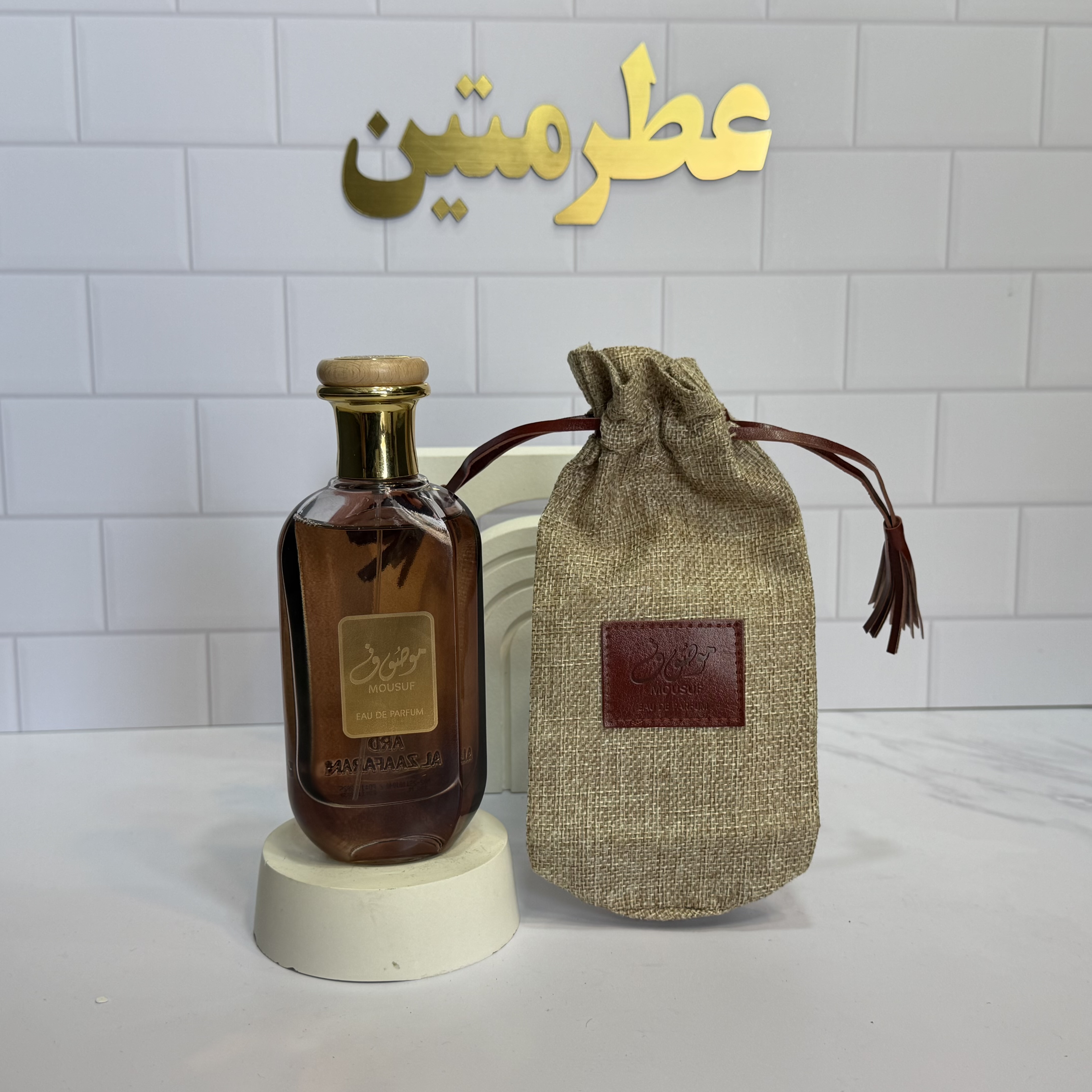 عطر ادوپرفیوم زنانه و‌ مردانه موصوف قهوه ای شرکت ارض الزعفران حجم ۱۰۰ میل
